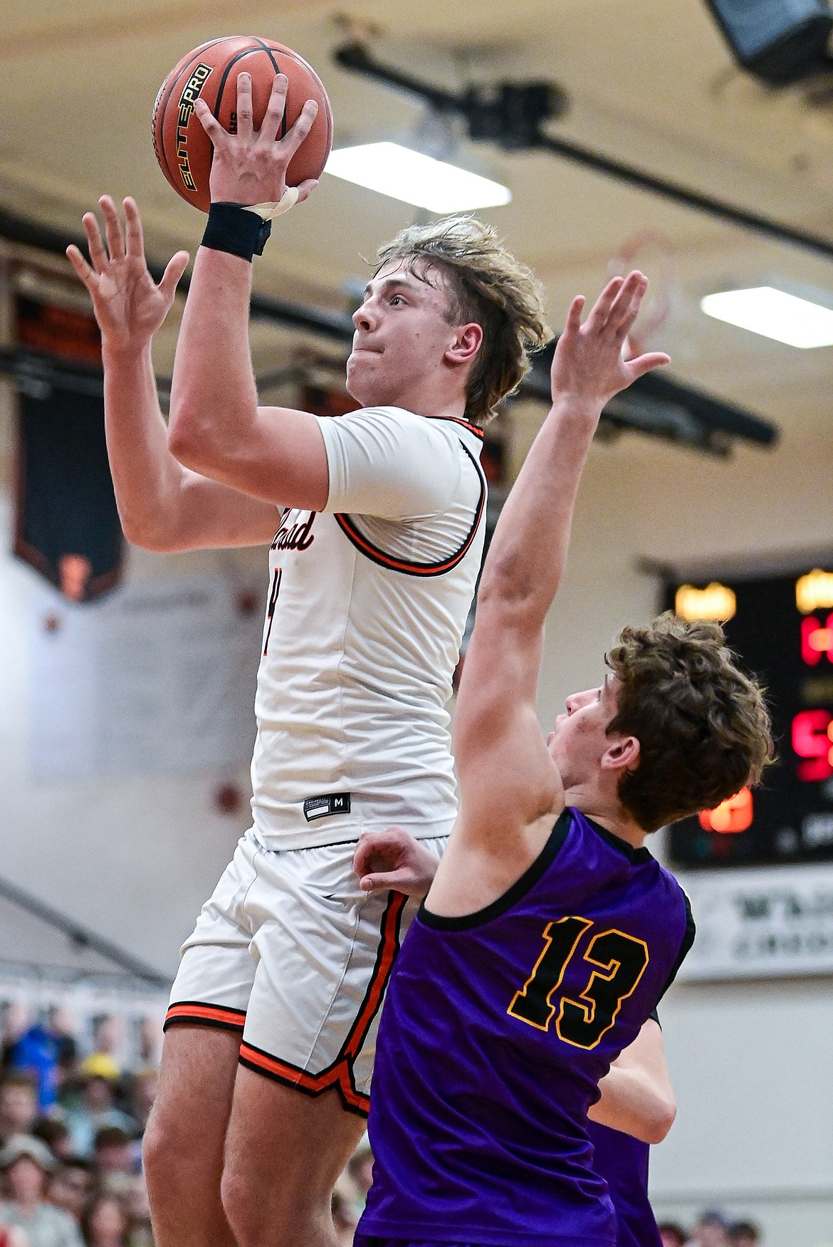 Flathead's Eli Coopman (4) drives to the basket in the first half against Missoula Sentinel at Flathead High School on Tuesday, Feb. 10. (Casey Kreider/Daily Inter Lake)
