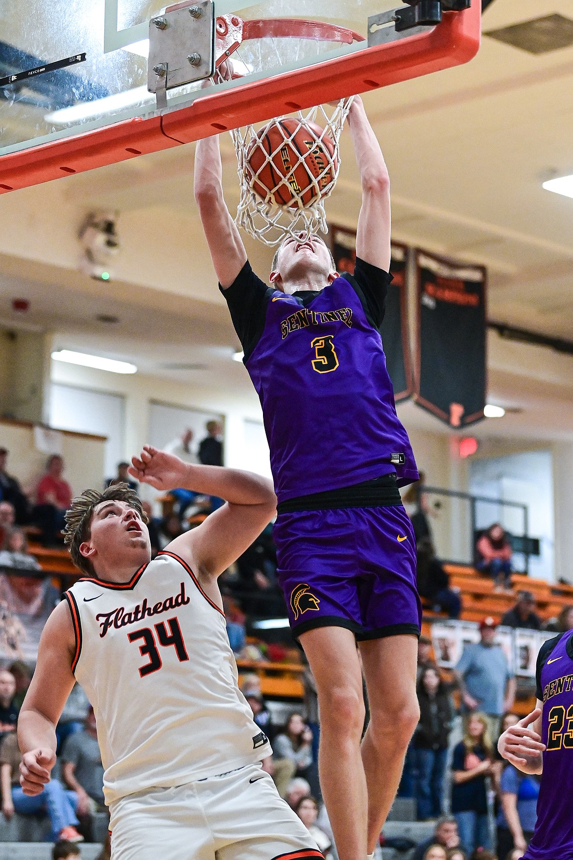 Missoula Sentinel's Lincoln Rogers (3) goes to the basket for a two-handed dunk in the third quarter against Flathead against Missoula Sentinel at Flathead High School on Tuesday, Feb. 10. (Casey Kreider/Daily Inter Lake)