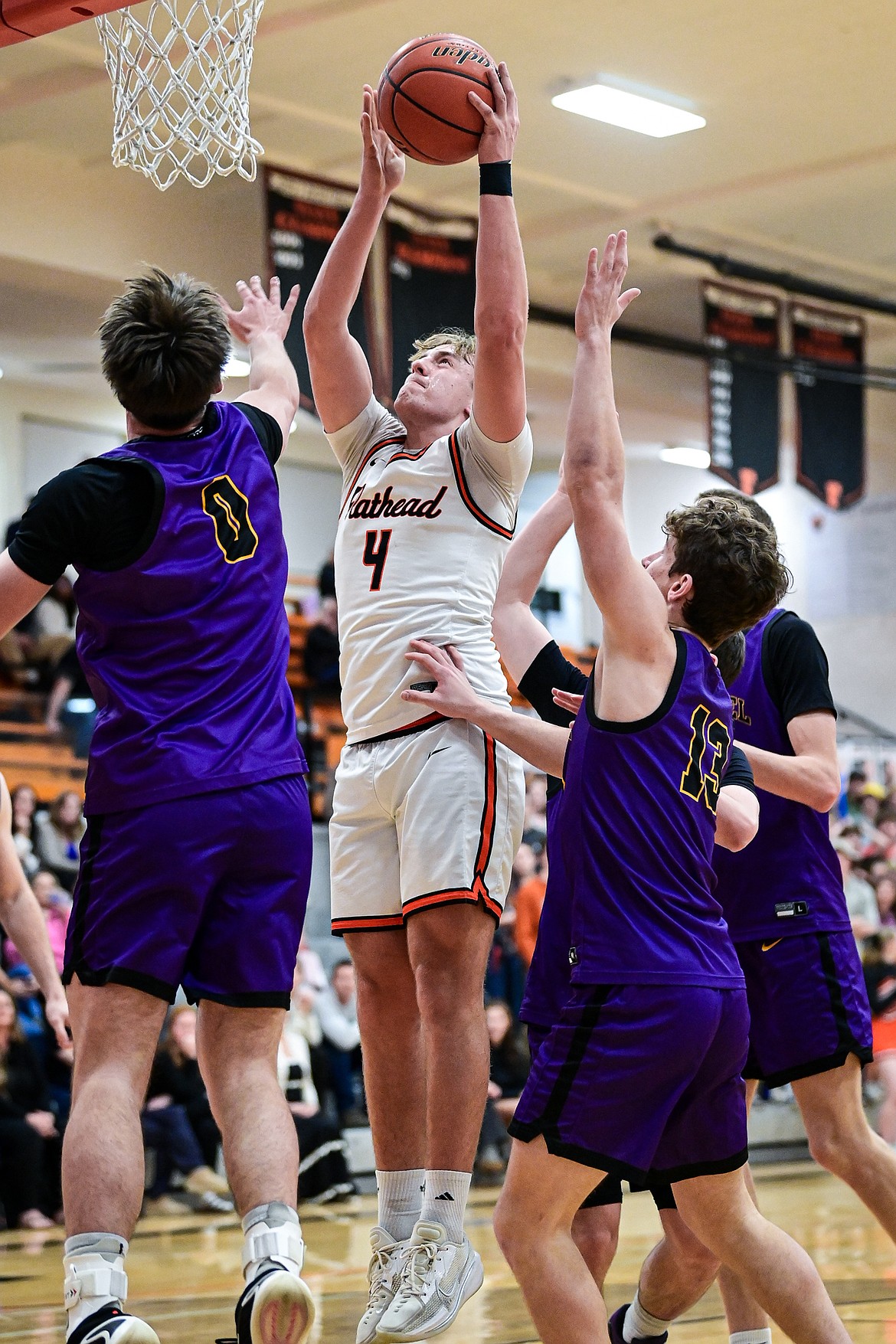 Flathead's Eli Coopman (4) sinks a bucket under the basket in the first half against Missoula Sentinel at Flathead High School on Tuesday, Feb. 10. (Casey Kreider/Daily Inter Lake)