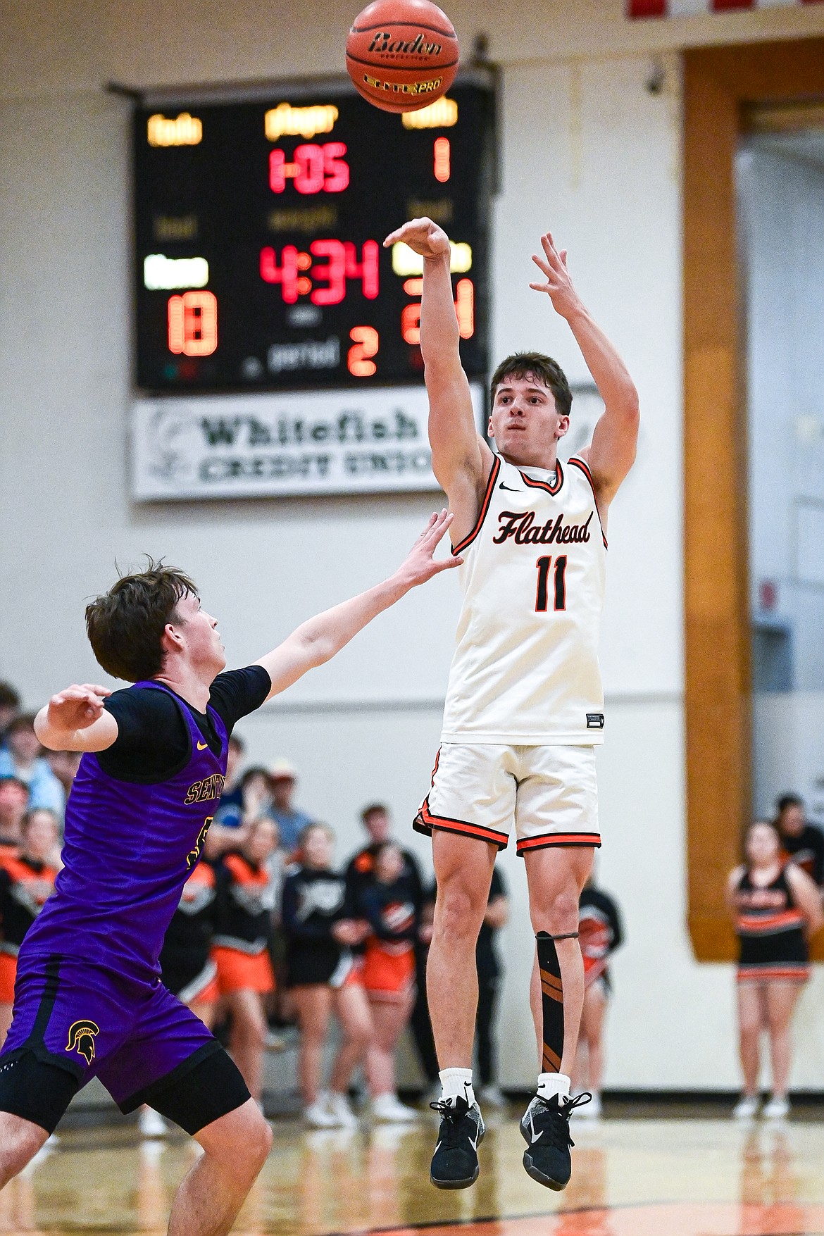 Flathead's Ben Reichard (11) knocks down a three in the second quarter against Missoula Sentinel at Flathead High School on Tuesday, Feb. 10. (Casey Kreider/Daily Inter Lake)