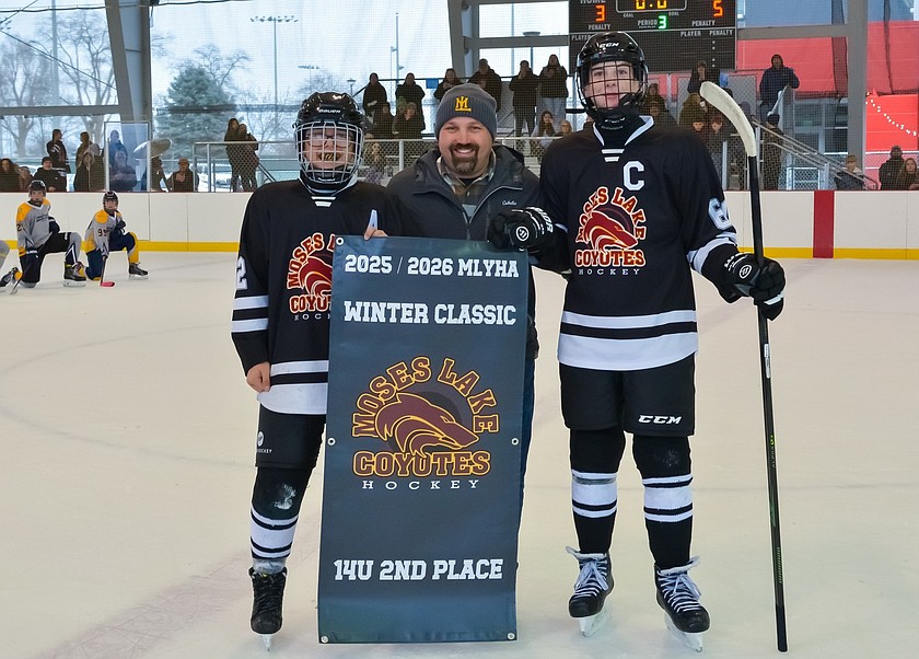 A pair of Moses Lake Coyotes 14U players pose for a photo with Tournament Director Scott Freidig. The Coyotes were runner up after a competitive championship loss 5-3 to the Coeur d’Alene Thunder 14U.