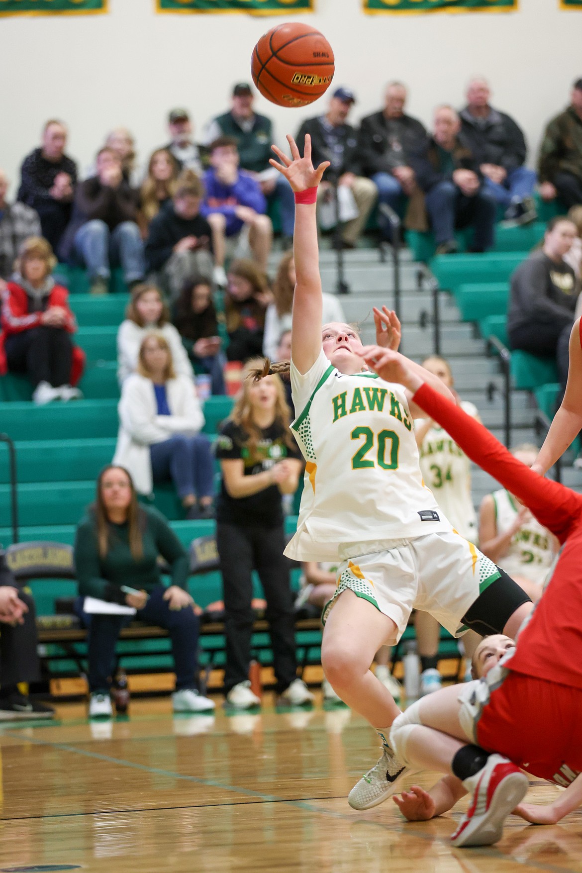 JASON DUCHOW PHOTOGRAPHY
Lakeland junior guard Presley Fagan puts up a shot as she is falling to the ground during the second half of Tuesday's 5A Region 1 girls basketball championship game at Hawk Court in Rathdrum.