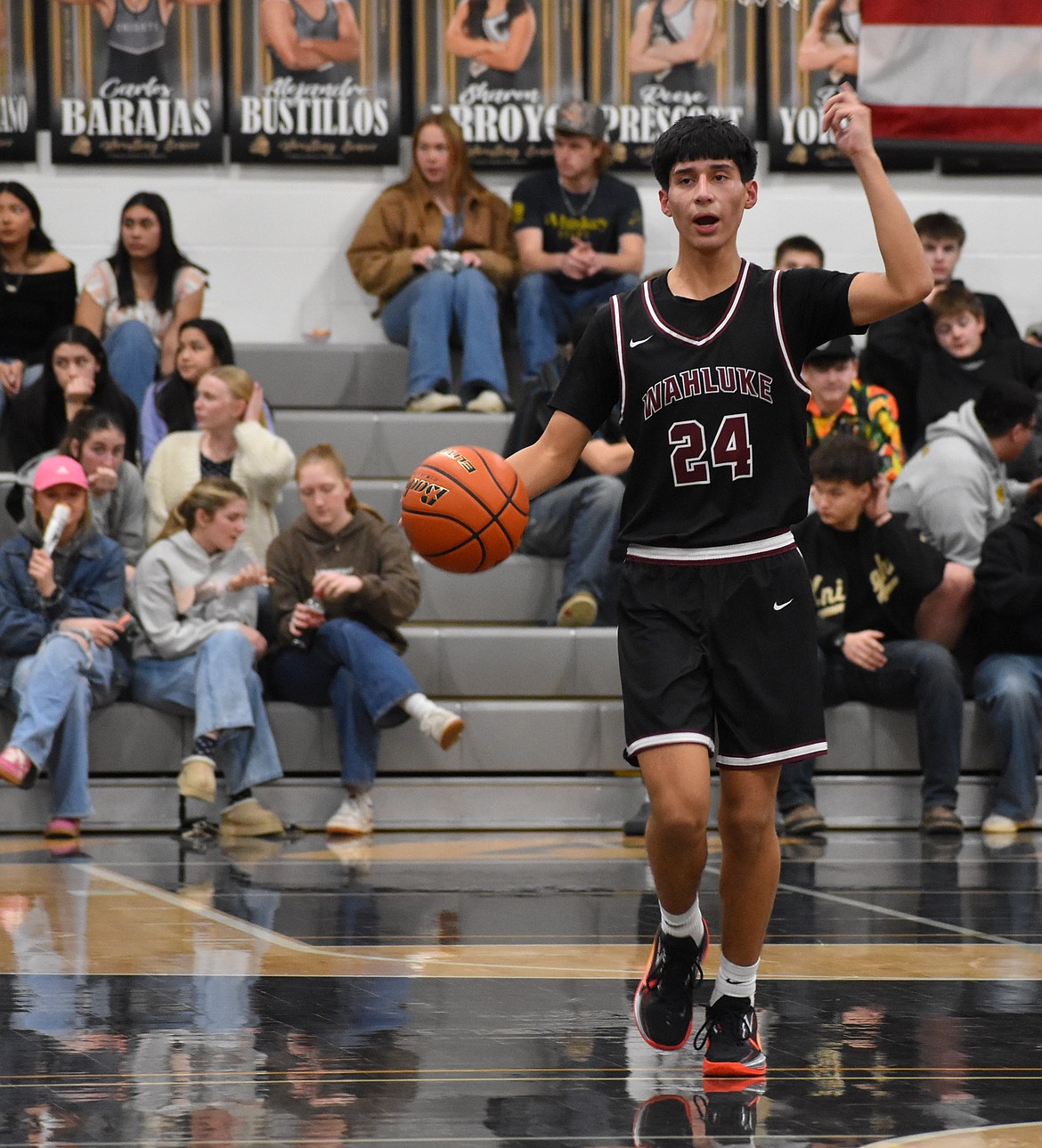 Kobe Corrales, a sophomore from Wahluke, calls out to his teammates near the hoop during Tuesday’s district matchup against Royal.