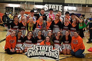The Ephrata Tigers Cheer team gathers around their first-place trophy after becoming the top scorer in the Game Day Co-ed event at the state championships over the weekend.