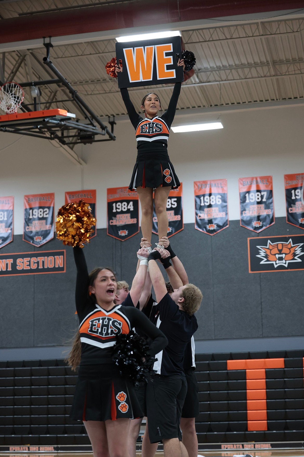 Tigers cheerleaders Chastaty Zepeda Garcia, Alexa Bastida and Brody Fluerkens seen working on a pep chant during a showcase earlier in the month.