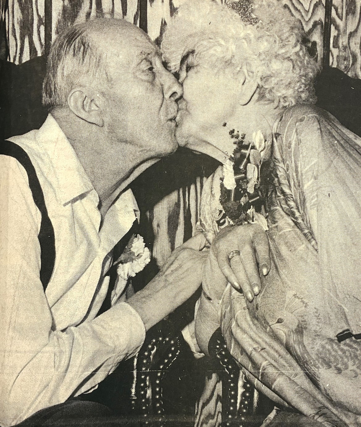 King Harold Berkey and Queen Martha Neilson kiss at the Sweetheart Ball in 1981.