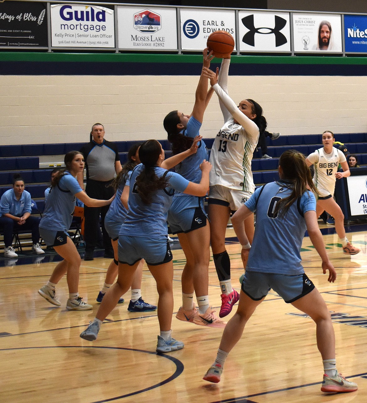 Kaliyah Evans (13) drives into traffic to put up a shot against Columbia Basin College. Evans finished the game with 28 points, eight assists and six rebounds.
