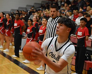 Huskies senior Trey Tovar looks to sink a three-pointer during Wednesday’s play-in game against East Valley.