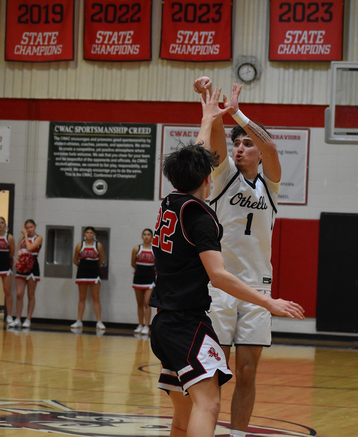 Quade Gonzalez, an OHS senior, aims for three during the district play-in game against East Valley Wednesday.
