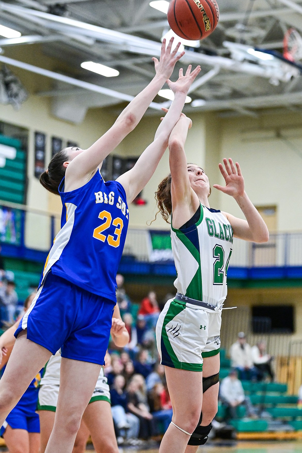Glacier's Cassidy Daniels (24) reaches for a rebound in the second quarter against Missoula Big Sky at Glacier High School on Saturday, Feb. 14. (Casey Kreider/Daily Inter Lake)