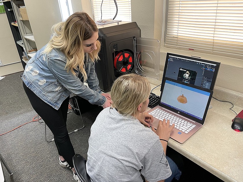 Wilson Creek students troubleshoot a 3D printer in a technology class in 2022. Voters, so far, are approving the district's operations levy.