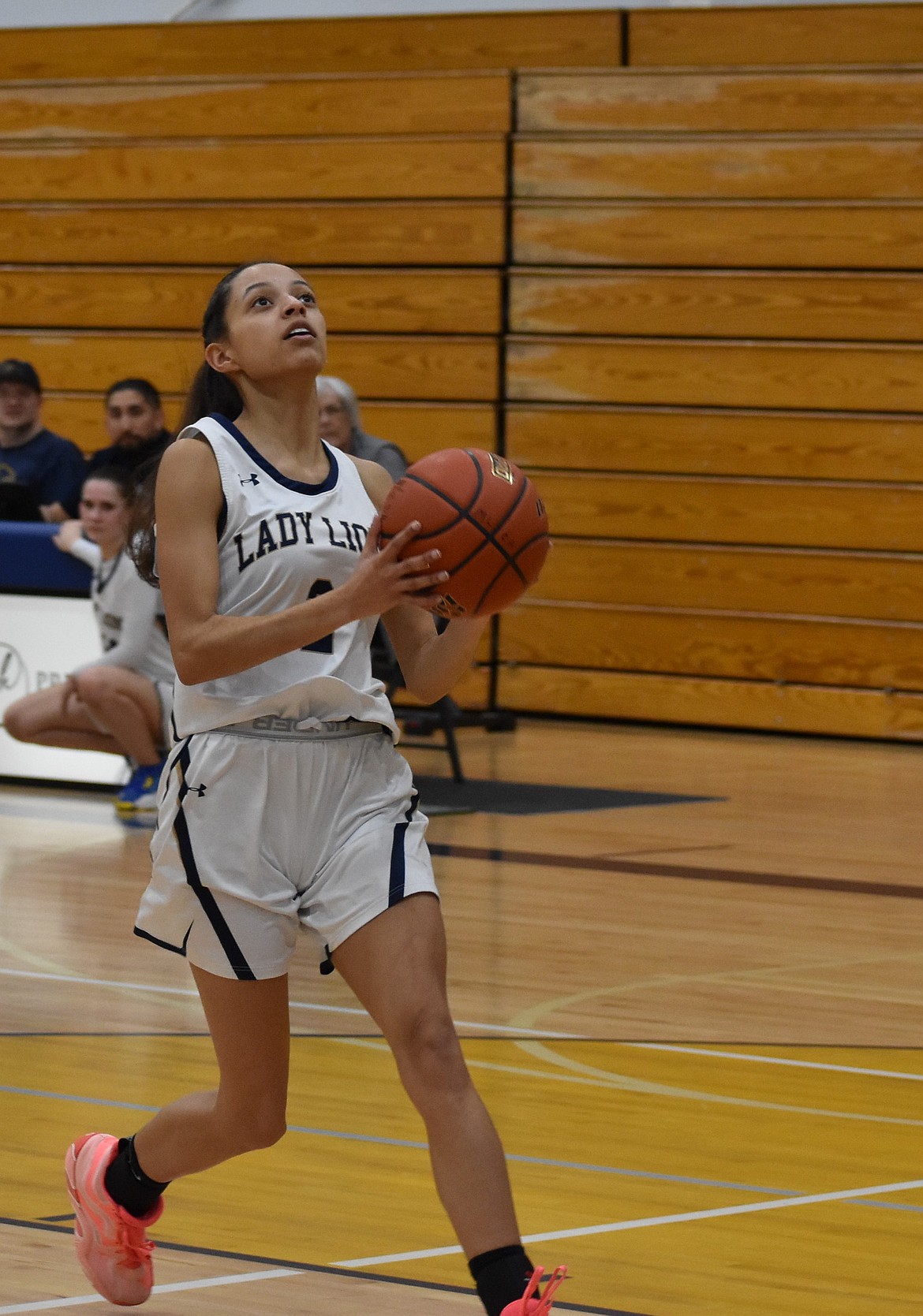 MLCA/CCS senior SanTahna Ferguson runs in to make a layup during the district semifinals against Soap Lake.
