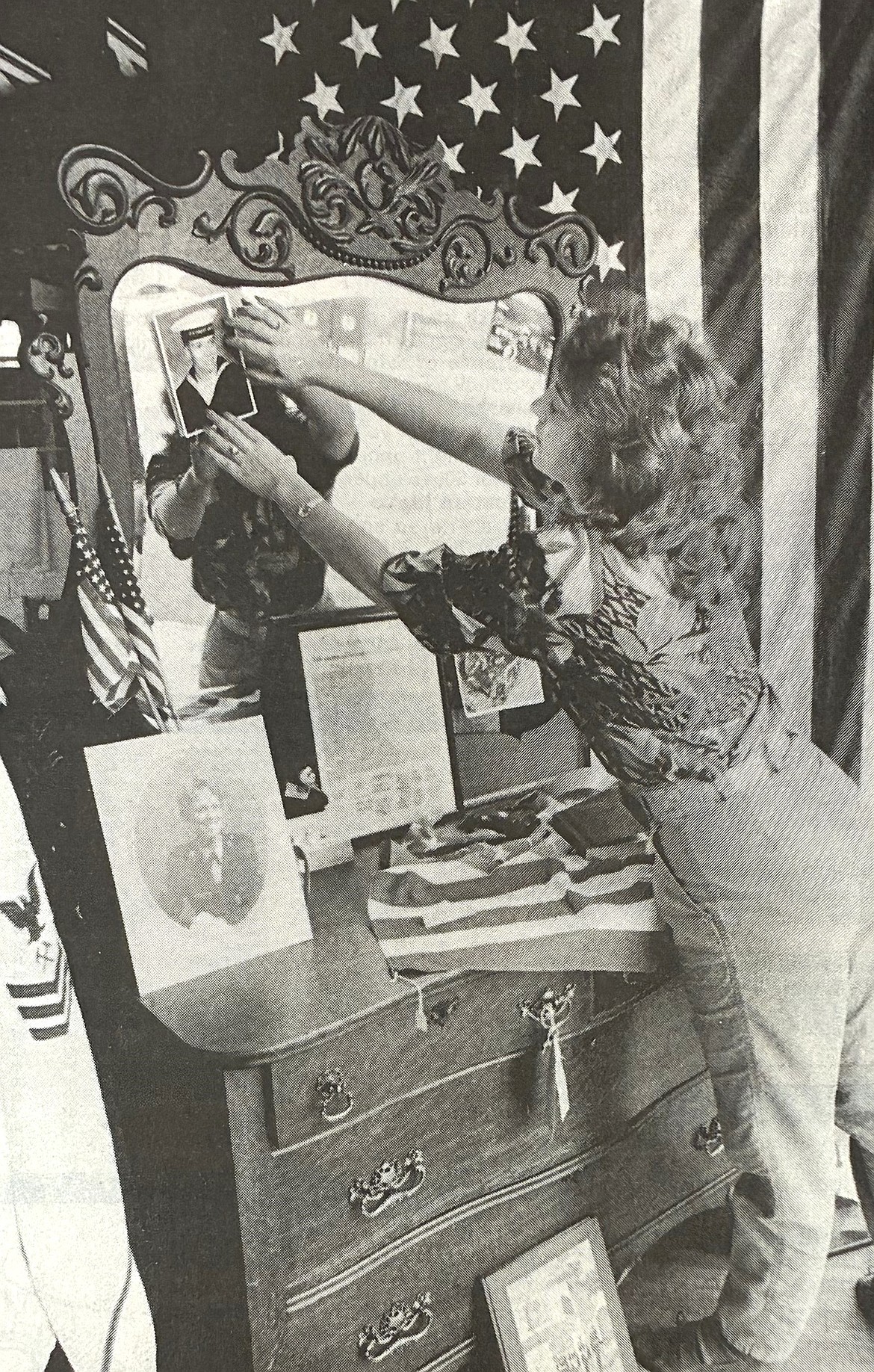 Manager Penny Swanlund of the Wiggett Antique Mall designs a window display to honor Operation Desert Storm warriors in 1991.