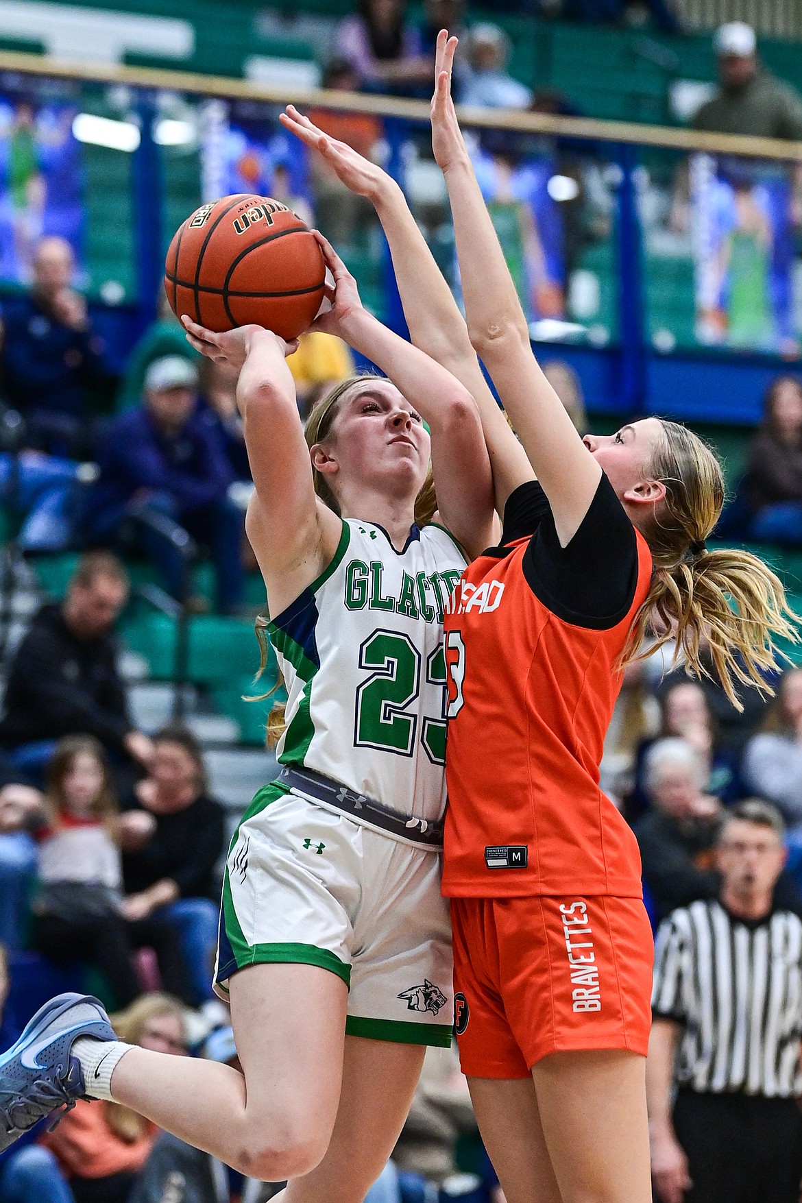 Glacier's Olivia Warriner (23) shoots guarded by Flathead's Caitlin Converse (13) in the second quarter at Glacier High School on Thursday, Feb. 19. (Casey Kreider/Daily Inter Lake)