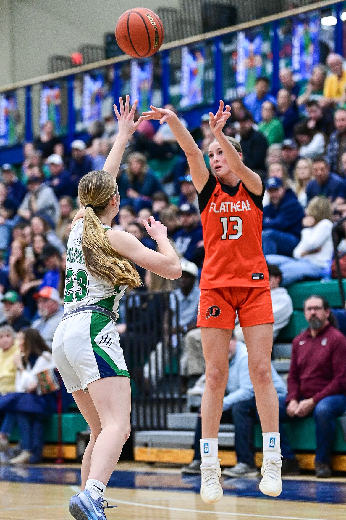Flathead's Caitlin Converse (13) knocks down a three in the first quarter against Glacier at Glacier High School on Thursday, Feb. 19. (Casey Kreider/Daily Inter Lake)