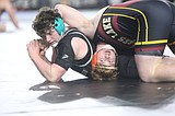 Seven Mavs heading to semis at Mat Classic