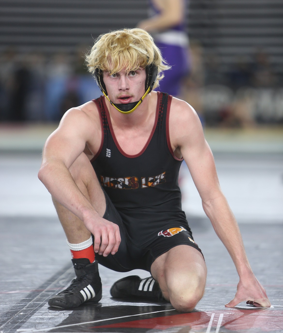 Ian Anderson catches his breath between rounds of the Mat Classic in Tacoma. Anderson will compete in the semifinals of the 157-pound class.