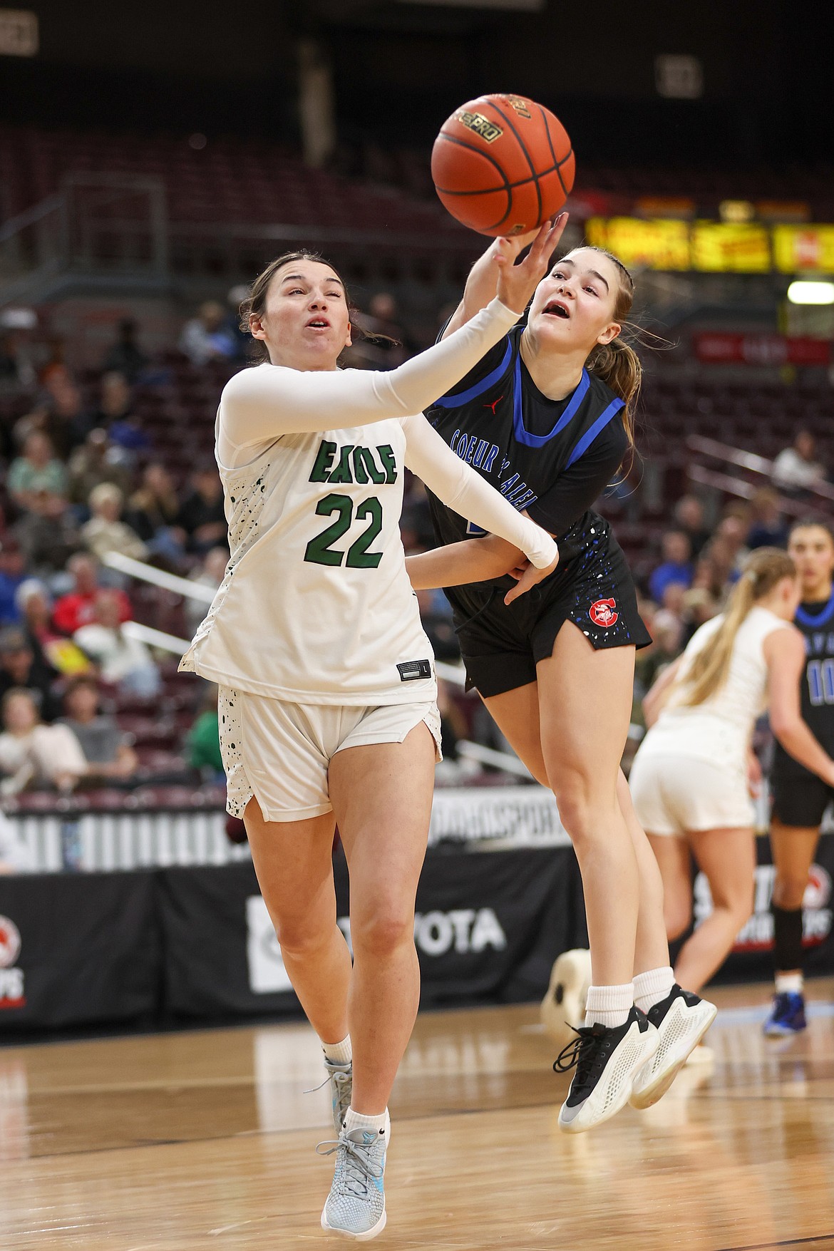 JASON DUCHOW PHOTOGRAPHY
Coeur d'Alene sophomore guard Lexie Wheeler attempts to deflect a pass from Eagle's Trinity Holslinger during the first half of Friday's state 6A girls basketball semifinal game at the Ford Idaho Center in Nampa.