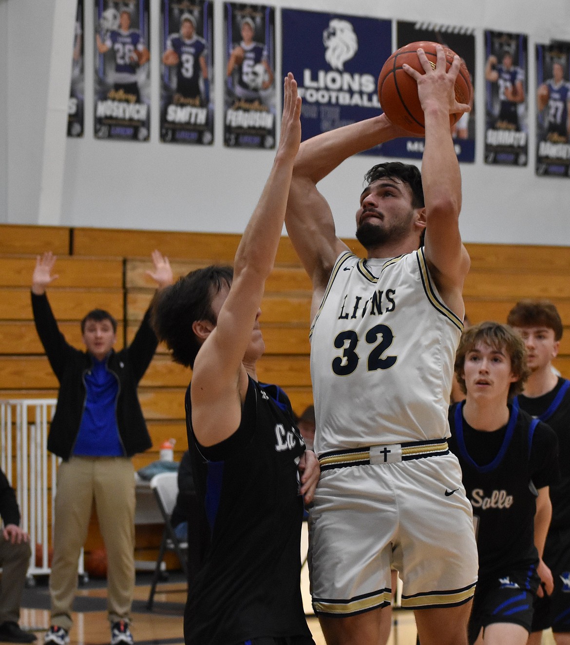 Dennis Gulenko, a senior for the Lions, comes up to make a shot under pressure during a previous game this season. Gulenko earned First Team All-League honors after Friday’s victory in the 1B District 5 championships.