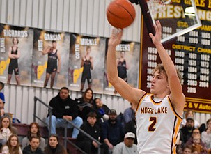 Mavs senior Brady Jay takes a shot with pressure on him from Sunnyside during Saturday’s game. Jay led the Mavs offense with 26 points scored during the matchup.