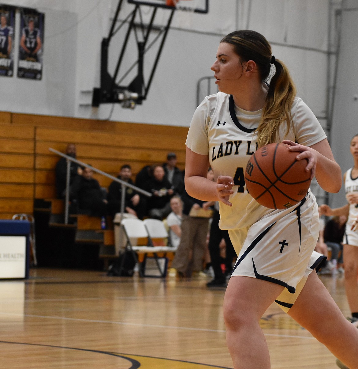 Lions junior Taylor Starnes runs down the side of the court during a previous home game this season.