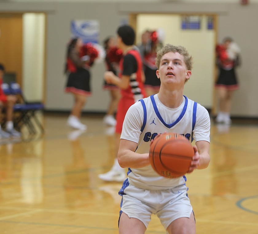 Eli Cox from the Warden Cougars prepares to shoot a free throw during a previous home game this season. The Cougars head into the first round of the state tournament this weekend where they face Adna Friday evening.