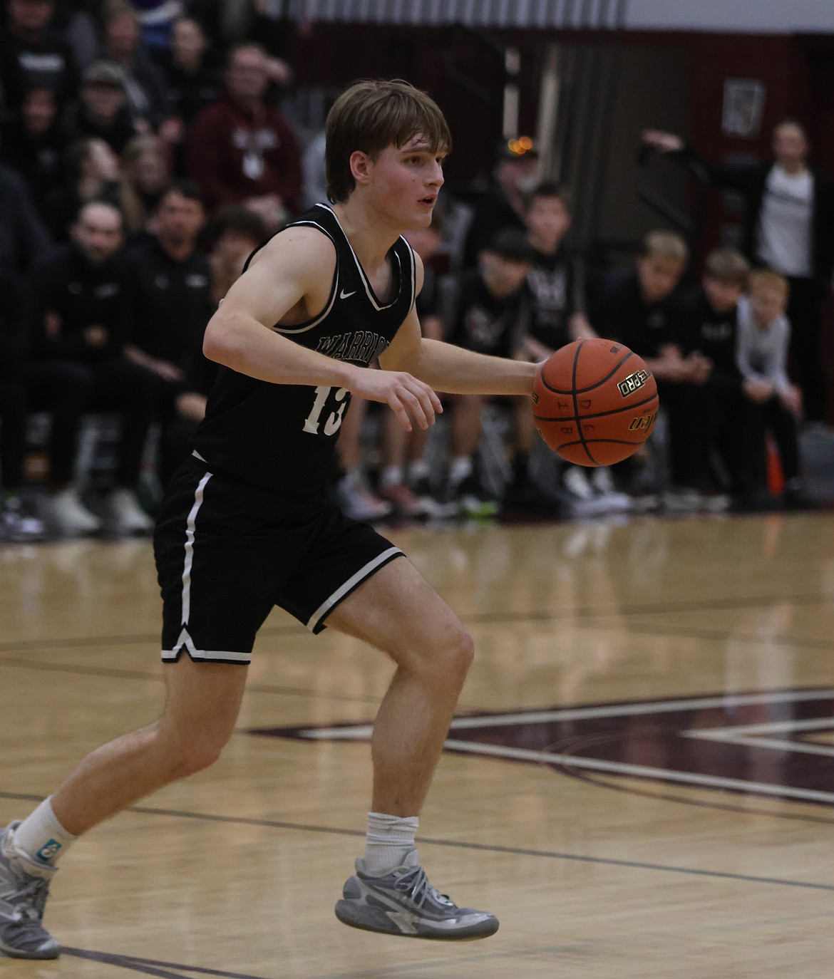 Josh Booker from ACH works quickly on his feet to go in for a layup during Saturday’s game against DeSales.