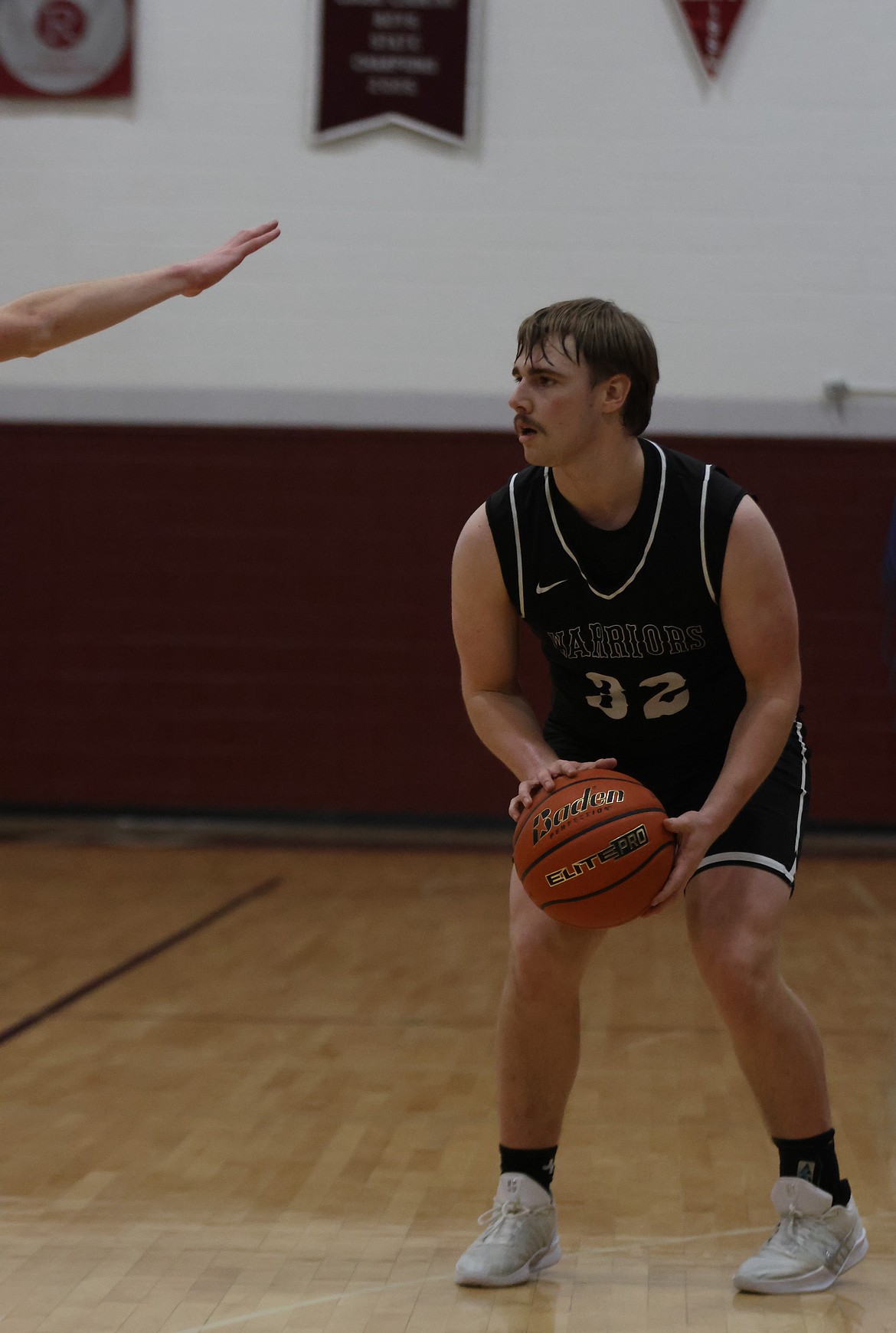Caden Correia from the Warriors prepares to take a shot with an oncoming DeSales defender on the way.