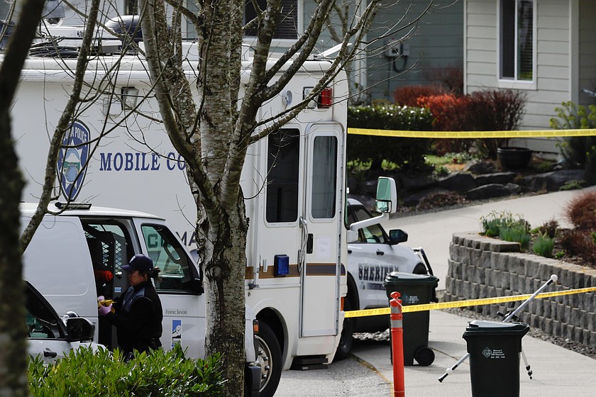 Authorities investigate the scene after reports that a man fatally stabbed multiple people Tuesday, Feb. 24, 2026, in Gig Harbor, Wash.
