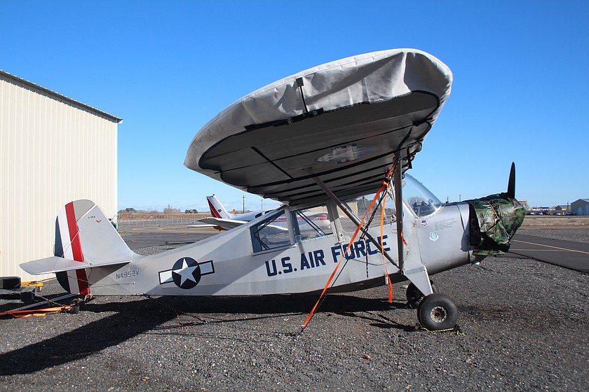 A vintage US Air Force plane is tied down against the wind at the Moses Lake Municipal Airport. Fortunately, the winds were light on Wednesday, but they’re projected to pick up by Friday.