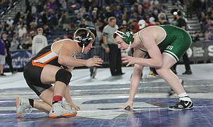 The Tigers’ Colt Staples, left, eyes his opponent during his match at the Mat Classic tournament. Ephrata sent five wrestlers to Tacoma with Staples and Peyton Woods reaching the podium.