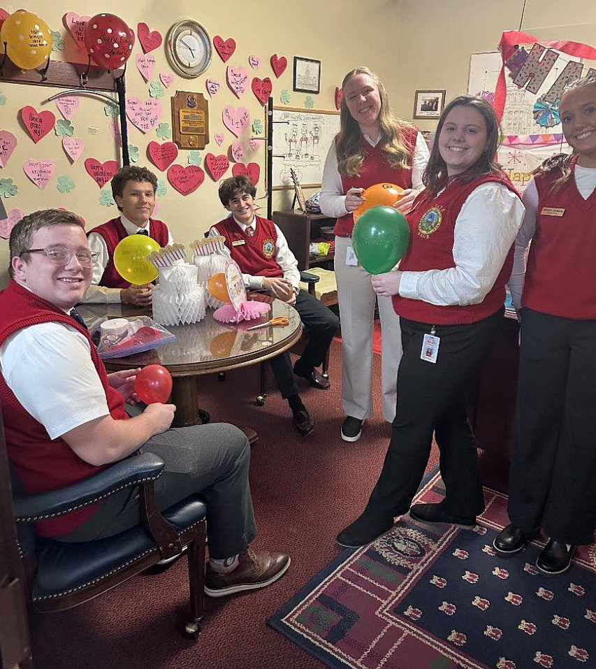 Coeur d'Alene High School senior Shayla Tyler, second from right, prepares for a Valentine's Day party with her fellow pages, including Lakeland High School senior Amanda Olson, third from right, during the first six weeks of the Idaho Senate Page Program in Boise. The program ended Feb. 20. A new wave of pages will assist senators during the next six weeks of the legislative session.