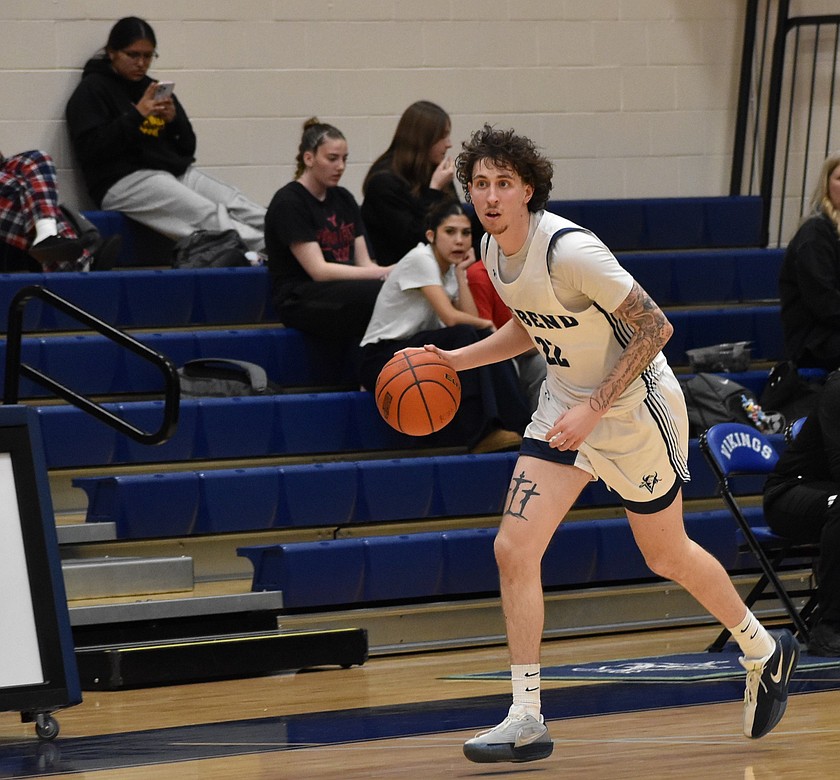 Vikings sophomore Miguel Taylor dribbles the ball along the sideline after gaining possession during Wednesday evening’s matchup against Yakima Valley.