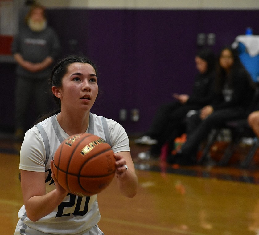 Warriors junior Grace Okamoto prepares to make a free throw during Saturday’s matchup against Muckleshoot in the state tourney.