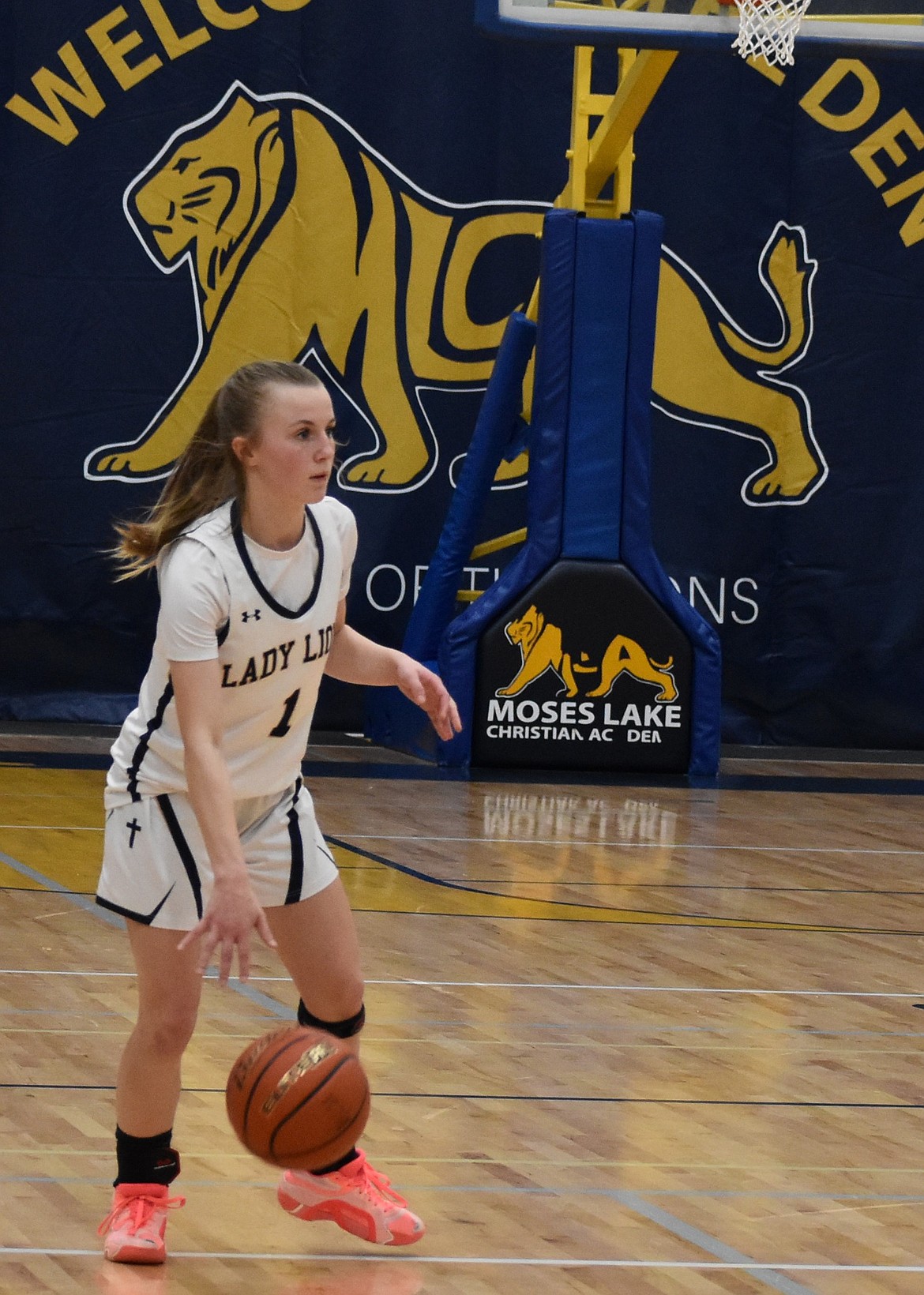 Lions junior Amelia Shopbell dribbles the ball in the center of the court after gaining possession during a previous matchup this season.