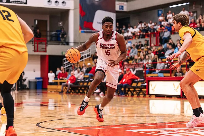 Kiree Huie (15) drives to the paint against an Idaho defender during their game Monday. The Eastern Washington mens team lost to the Vandals 85-81 in a competitive battle to close the regular season.