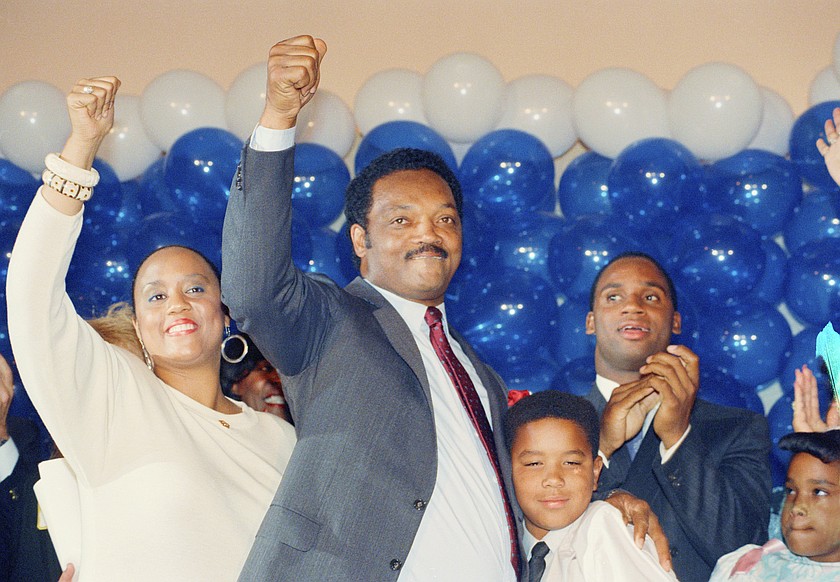 Jesse Jackson is joined by his daughter, Santita, and son Jonathan, far right, and unidentified youngster at the Los Angeles Hilton Hotel, June 8, 1988 after falling in defeat to Massachusetts Gov. Michael Dukakis in the California Democratic primary.
