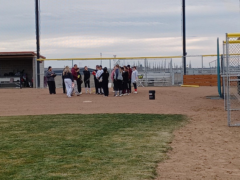The Moses Lake High School softball team enjoys a bit of sun on their second day of practice Tuesday.