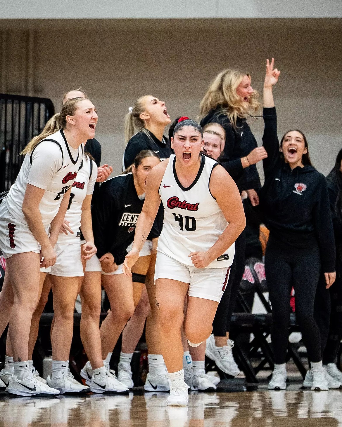 Annalee Coronado (40), a junior from the Wildcats, runs past her teammates on the sideline as they all cheer during a prior home game this season.