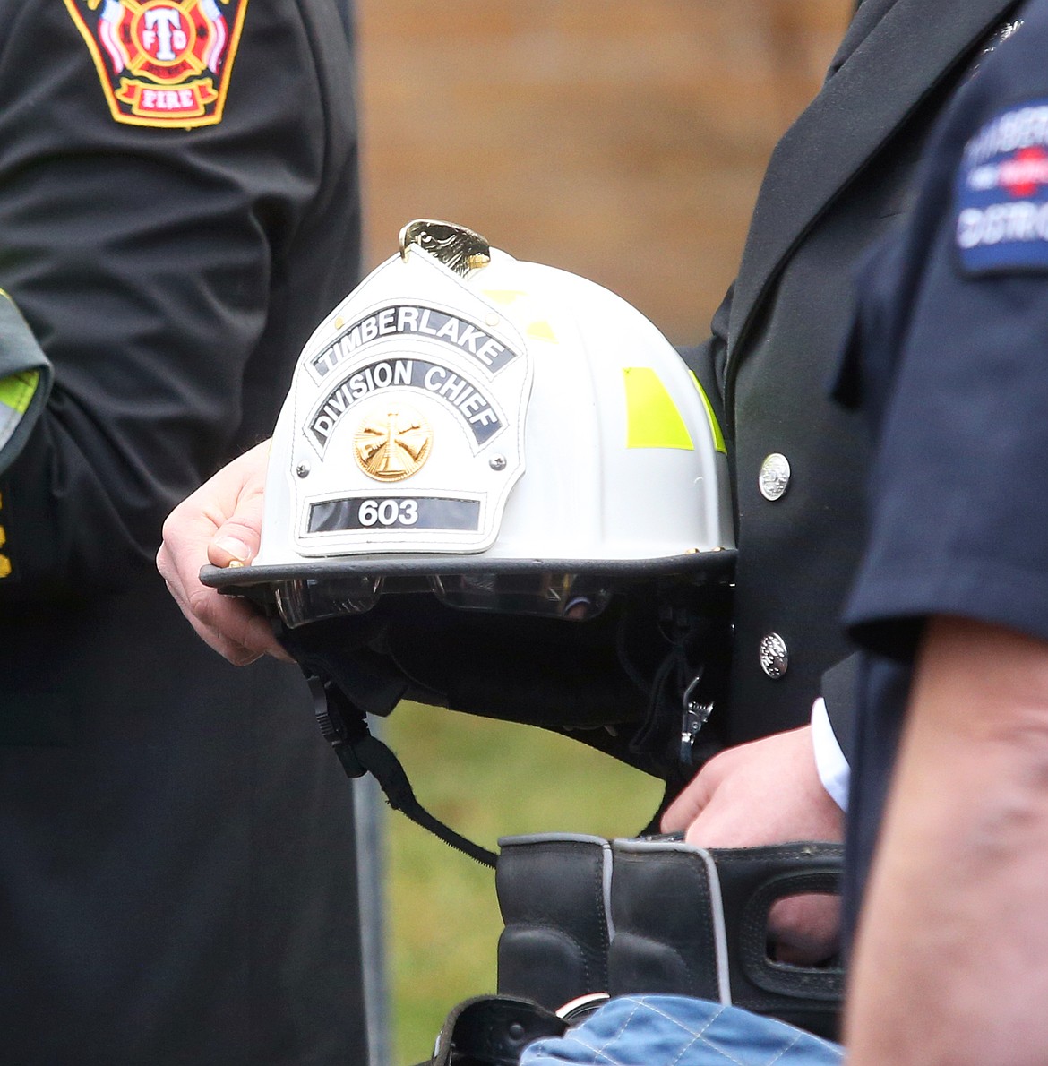 William "Bill" Wright's fire gear is carried out during the final procession at his memorial service at North Idaho College.