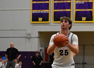 Max Grindy, a junior from ACH, prepares to make a free throw during the first round of the state tournament. The Warriors move on to the semifinals after earning a victory Thursday.