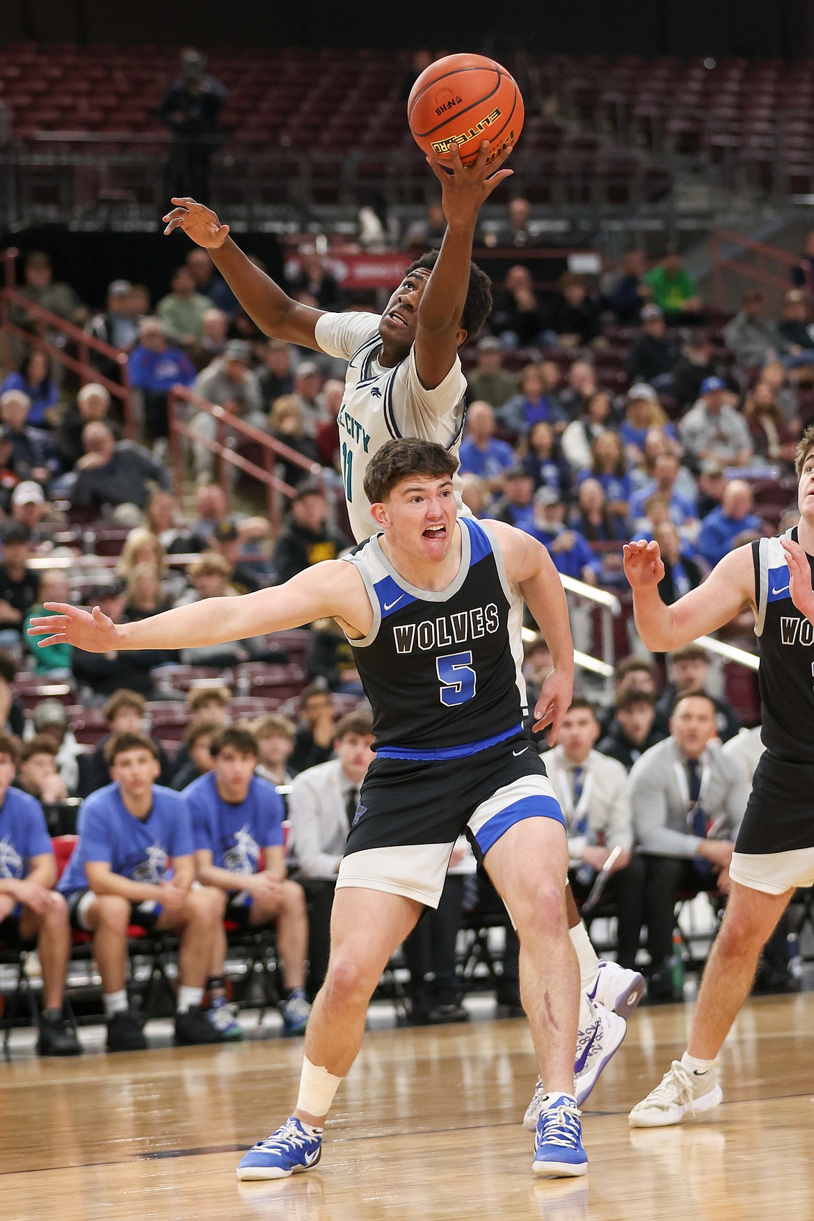 JASON DUCHOW PHOTOGRAPHY
Lake City senior Josh Watson extends to grab the ball over Timberline's Benton Bates during Thursday's state 6A boys basketball opening round game at the Ford Idaho Center in Nampa.