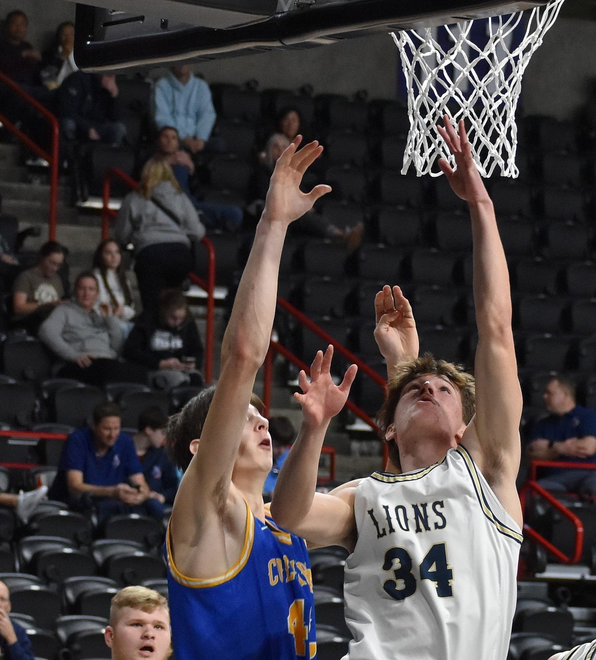 Kevin Jorgensen, a junior from MLCA/CCS puts the ball in the bucket for two points against Columbia Adventist.