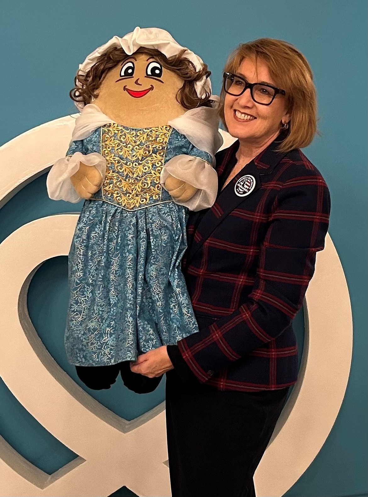 Idaho State Treasurer Julie Ellsworth with Martha-tot Washingtater, the mascot of the America250 Idaho service challenge.