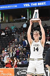MLCA/CCS senior James Robertson holds up the state hardware after the team’s victory over Liberty Christian to earn fourth in state.