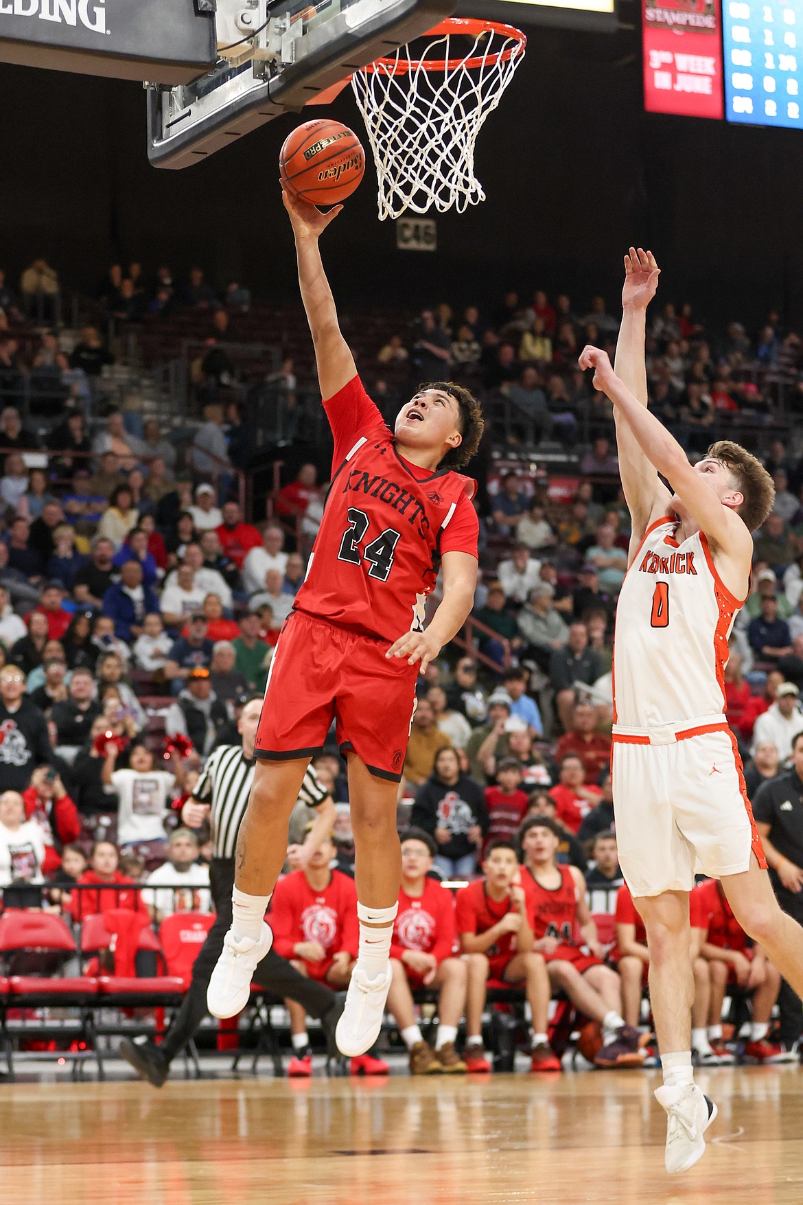 JASON DUCHOW PHOTOGRAPHY
Lakeside sophomore Jose Ramirez (24) goes up for a layup as Maddox Kirkland (0) defends Saturday in the state 2A championship game at the Ford Idaho Center in Nampa.