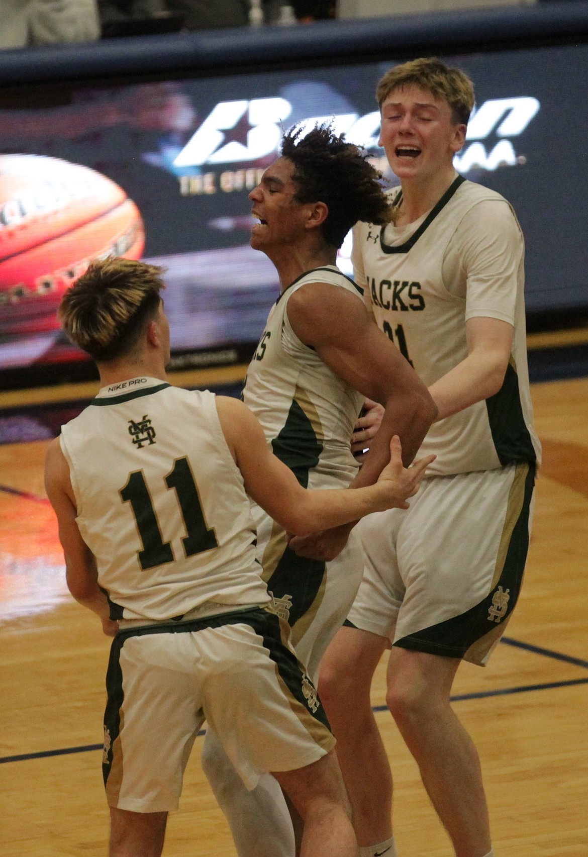 MARK NELKE/Press
St. Maries senior Brock Barta (11), senior JJ Yearout and junior Landon Riberich (21) celebrate after the Lumberjacks beat Ririe in the semifinals of the state 3A boys basketball tournament Friday at Meridian High. St. Maries will play Wendell today at 12:40 p.m. PST at the Ford Idaho Center in Nampa in the state title game.
