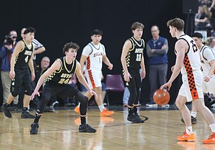 The Knights’ Grant Wardenaar (24) steps up to guard a Zillah player during the 1A state semifinals. The Knights went 24-5 this season and finished third in the 1A state basketball tournament.