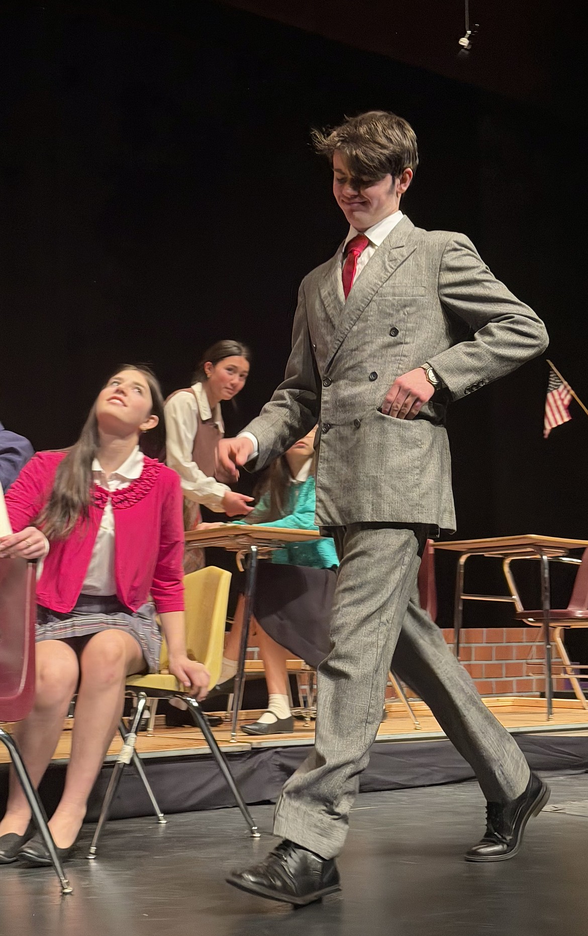 Teacher Paul Barringer (Nicholas Ealy) struts through the classroom.