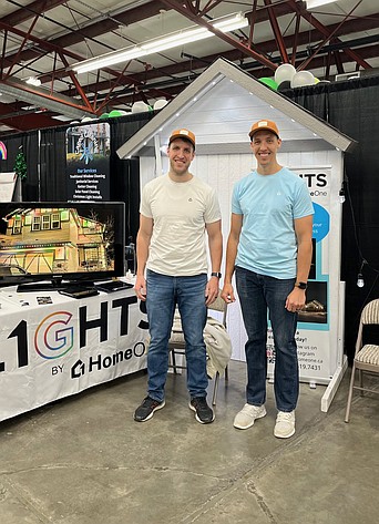 Brothers Zach Thomas, left, and Nate Thomas represent Lights by HomeOne at the Columbia Basin Home and Garden Show in February.
